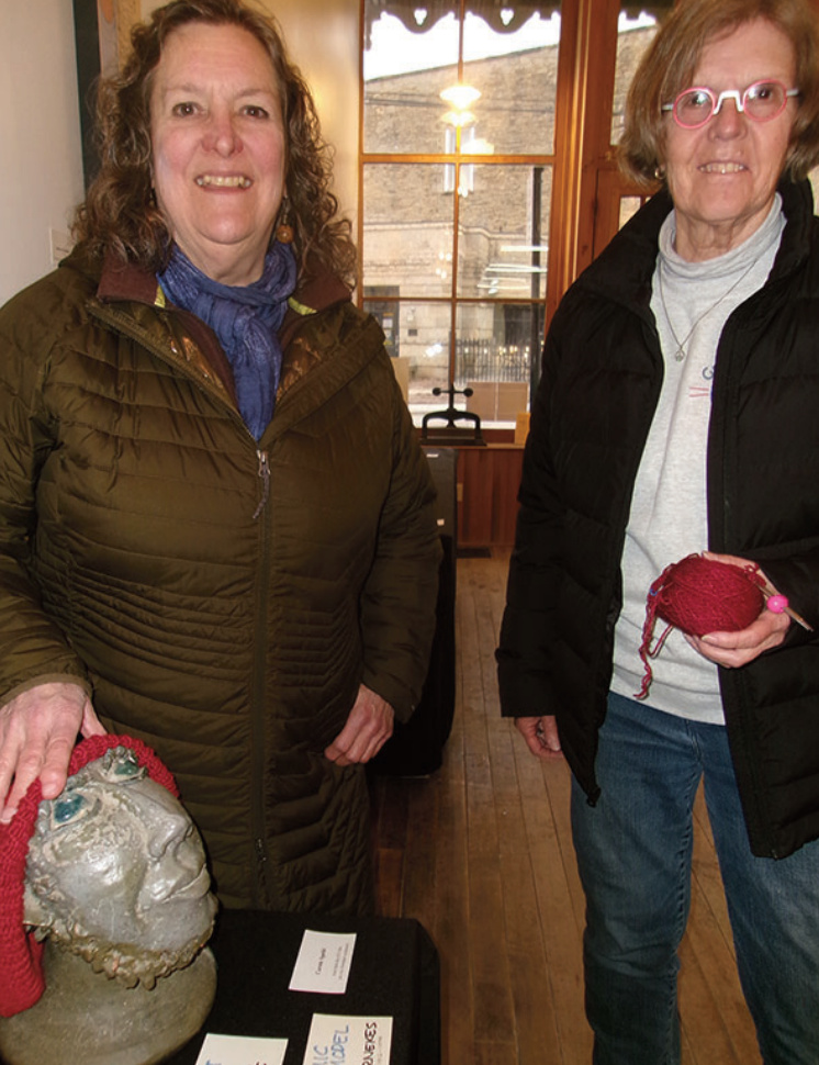 Carole Spelic of Mineral Point and Lana Caywood of Platteville each chose knitting a hat as a February art project.