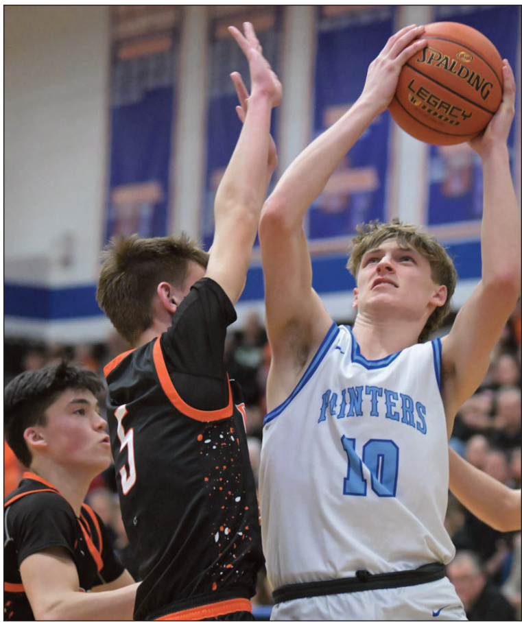 Aiden Patterson puts a shot up against Dodger Elliot Hesseling. Bret Peterson photo.