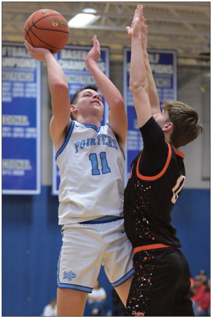 Drew Aschliman hit some tough shots. Here he's up against Dodger Griffin Busch. Photo by Bret Peterson.