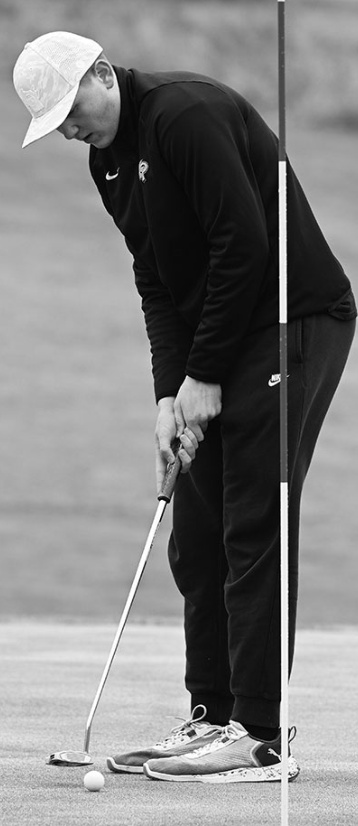 Brady Haas strokes a short putt. Photo by Anita Schmid.