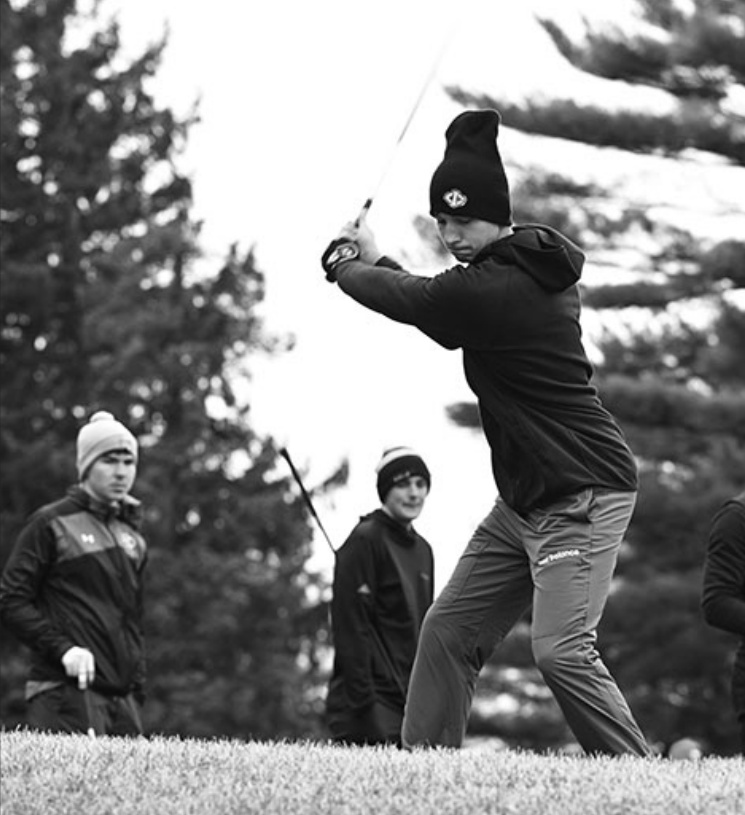 Drew Aschliman fired a 70 in cold, windy and wet conditions as the Pointers opened play at Dodge Point Country Club Saturday. Photo by Anita Schmid.