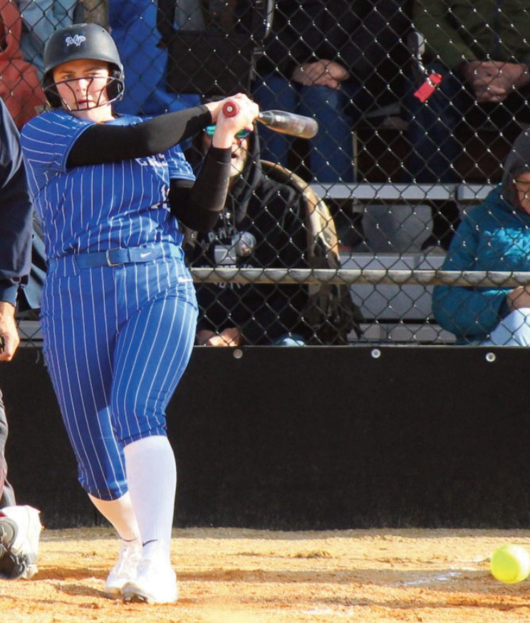 Mineral Point's Maddy Kabat hits this ball in a game Monday night in Livingston against lowa-Grant. Photo by John Dalton.