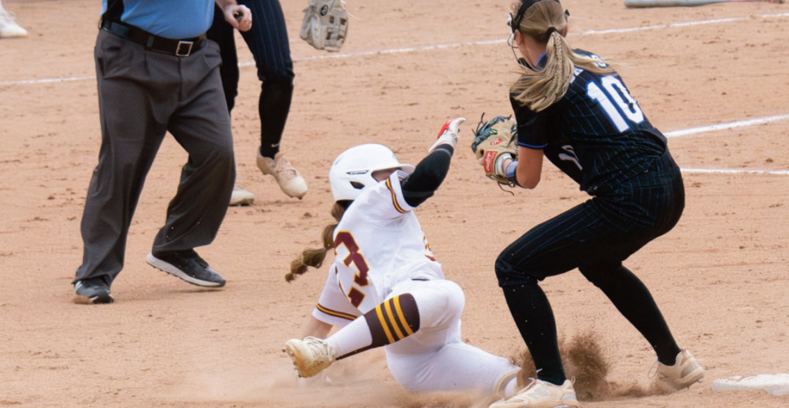 There was a lot of action going on at first base as Jadyn Schultz takes a throw for an out. Photo by Robin Wiegman.