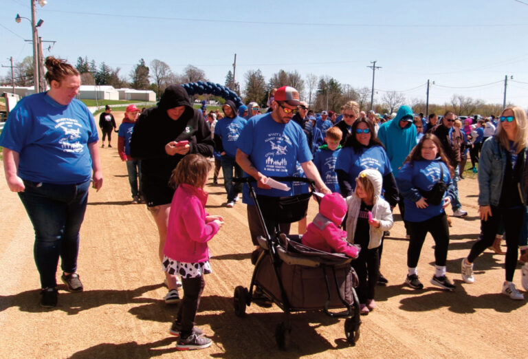 This photo from 2025 shows people on the lowa County Fairgrounds track during the first Wyatt's Walk. The child abuse prevention and awareness event will be April 25 this year.