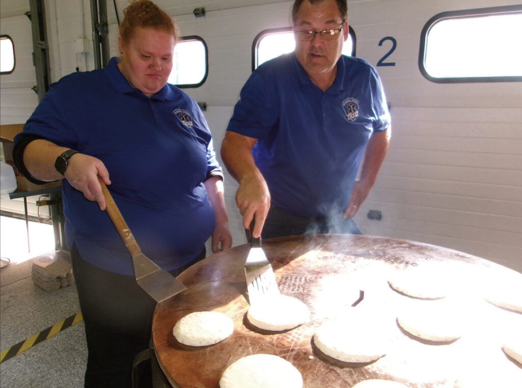 Doug Rider and Sam Holz worked the griddle at the Mineral Point Rescue Squad pancake breakfast Sunday morning.