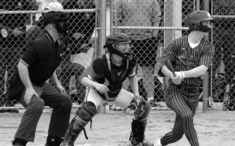 Brett Bossert watches the ball sail for a single. John Dalton photo.