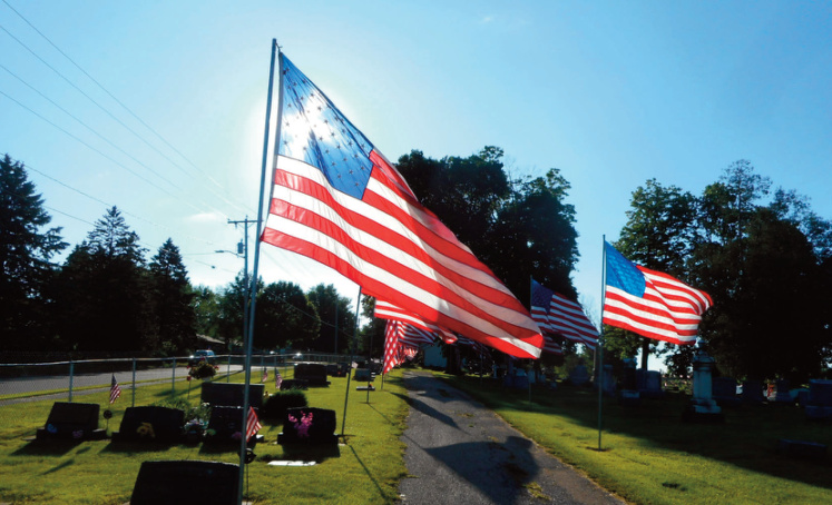 With sun shining and breezes blowing, the Avenue of Flags is a moving sight.