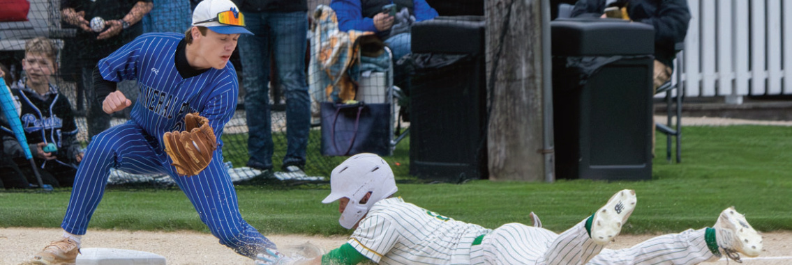 Elliot Kite makes a play on a sliding Pecatonica runner. Robin Wiegman photo.