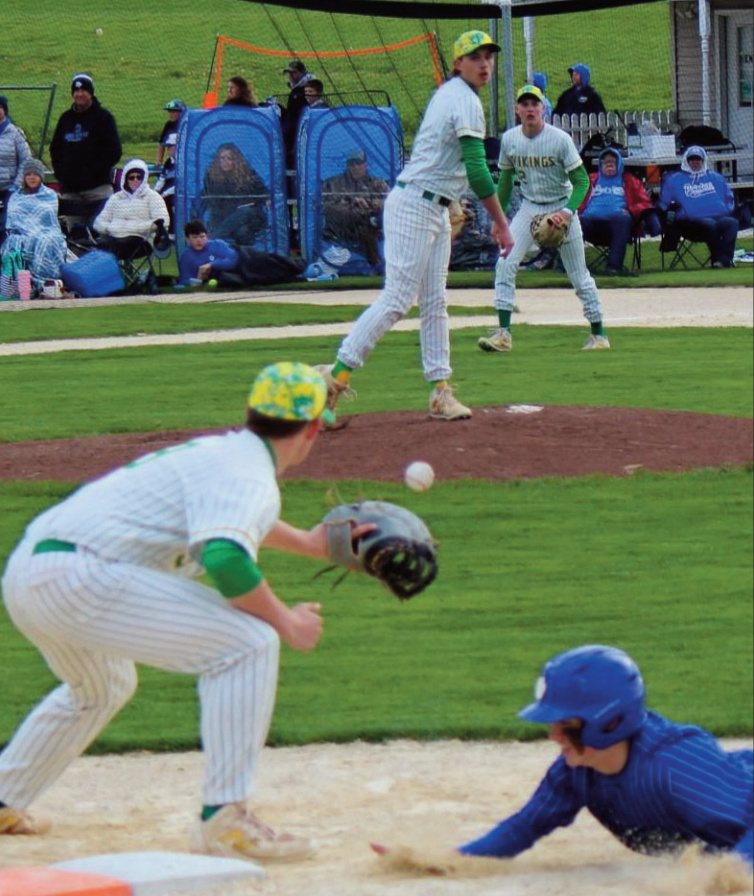 Pointer Connor Rolli barely escapes this pick-off attempt by Pecatonica pitcher Austin Enloe.