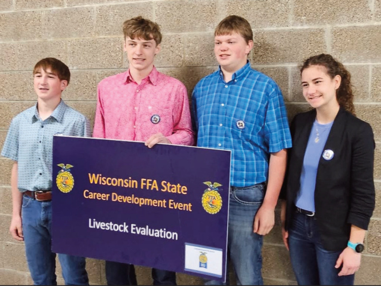 Members of the championship team include (left to right) Johnny Robinson, Aiden Patterson, Riley Sennhenn, and Faye Schuette.