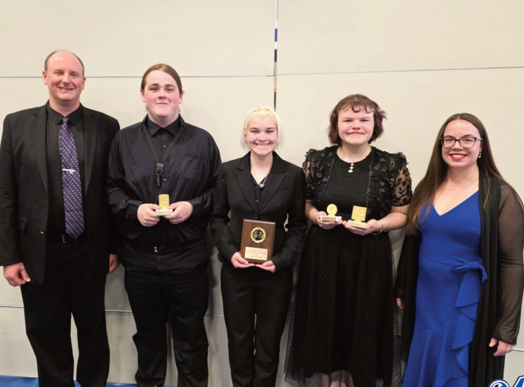 Pictured left to right are Band Director Matt Nevers, Logan Johnson, recipient of the Louis Armstrong Jazz Award; Ella Wilson, recipient of the Music Boosters Award; Lilly Murn, recipient of both the John Philip Sousa Band Award and the National School Choral Award; and Choir Director Ashley Calderon-McHugh.