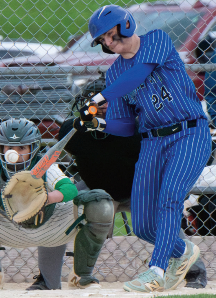 Evan Kearns connects on a pitch at the Field of Dreams. Robin Wiegman photo.