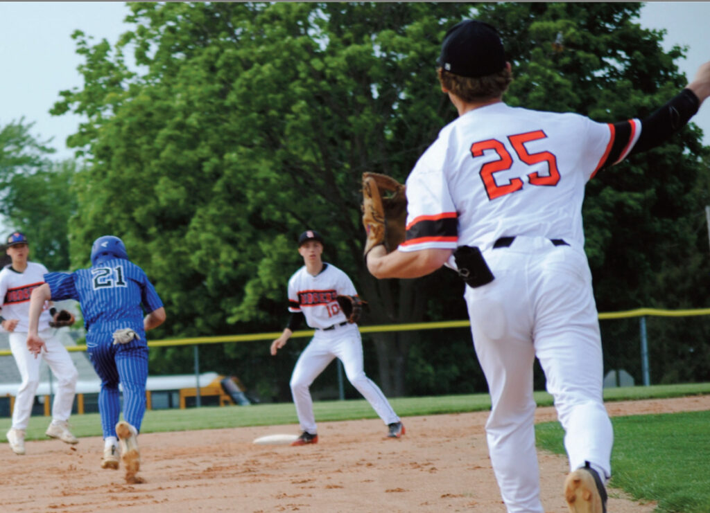 Elliot Kite is caught in a run down in action against Dodgeville. Photo by Tommi Crubaugh.