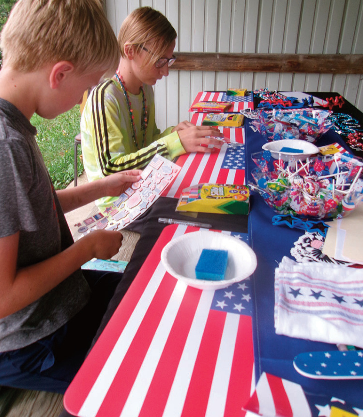 Camden Smith and Holden Smith worked on crafts that celebrated America's 250th anniversary while others enjoyed food and music at an All American Picnic Saturday at the American Legion Hall. Legion and VFW auxiliaries plan that the picnic will become an annual event.