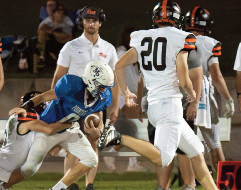 Tyler ingwell tries to get away from a Dodgeville tackle. Photo by Robin Wiegman.