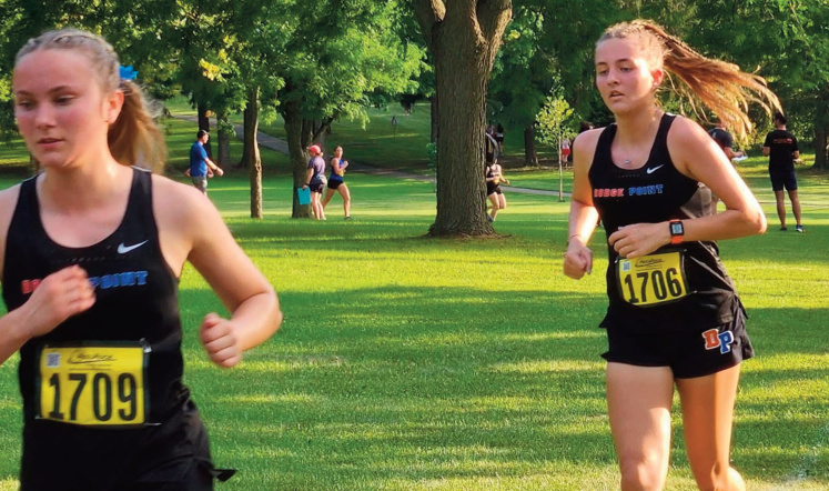 Payton Christopher (front) and Raina Arndt both try to move up.