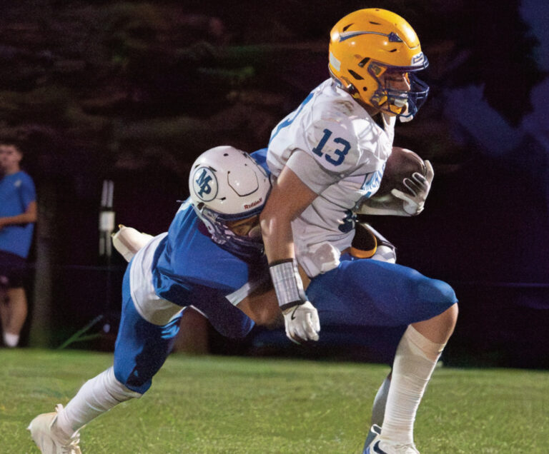 Memphis Burkhalter makes a flying tackle on an Arrow. Photo by Robin Wiegman.