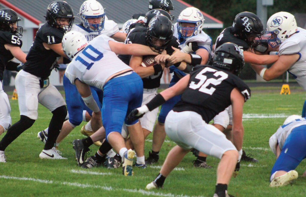 The trenches were a tough place to be Friday night at Darlington. Several Pointers, along with Clayton Yanna (10) try to stop a Redbird running back.