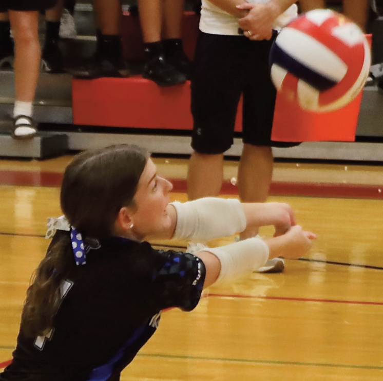 Annison Goninen saves the ball. Photo by Tori Carey.