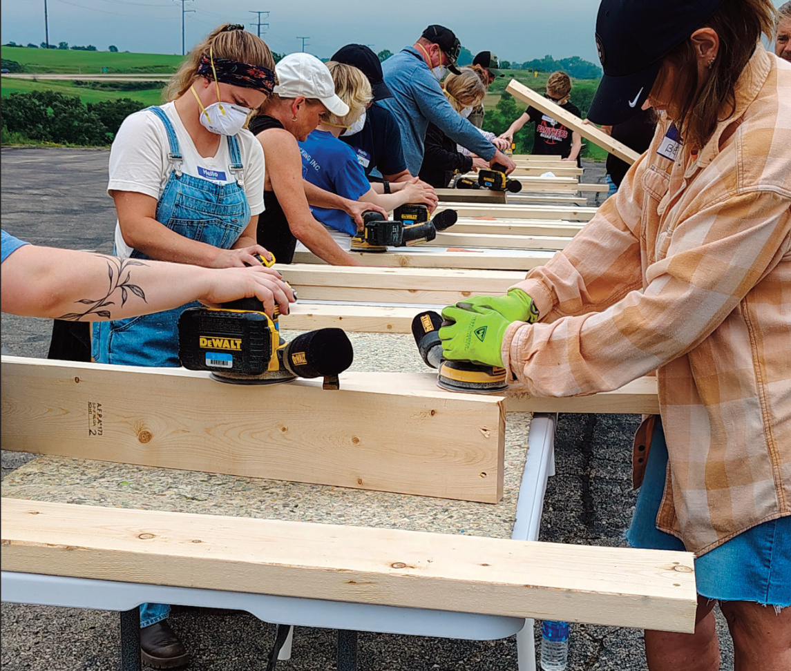People sanding wood